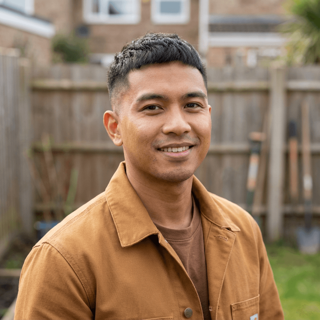James Tran in a collared shirt at a commercial property entrance